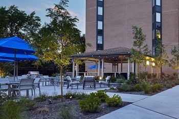 Large courtyard with seating, gazebo and outdoor grilling station